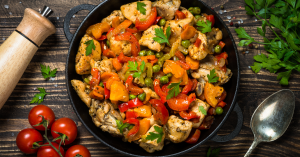 picture of a chicken stir-fry dinner with bell pepper and edamame beans